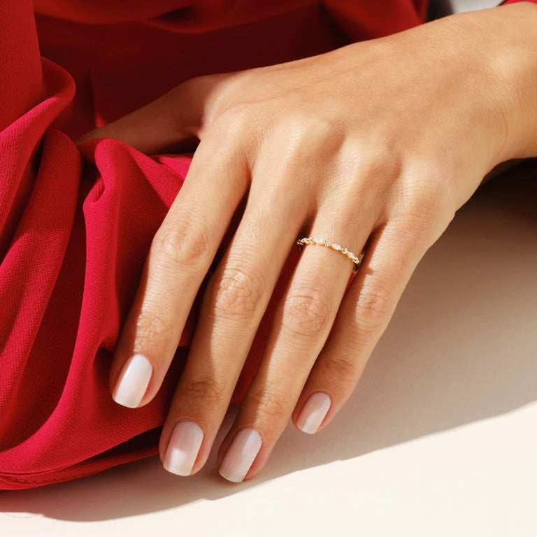Round diamond engagement ring with marquise band

