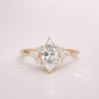 Marquise Moissanite Ring With Marquise And Round Cut Side Stones
