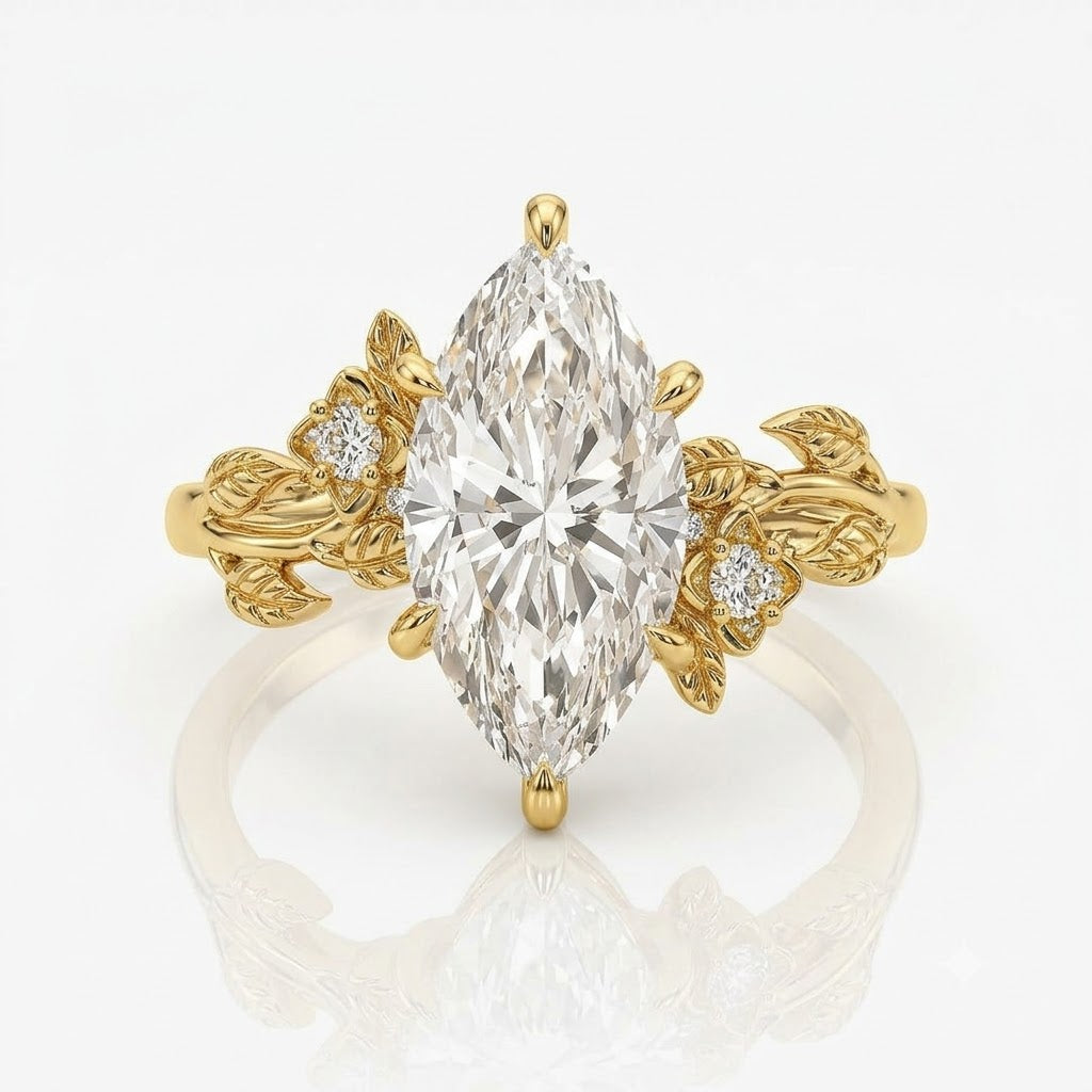 A yellow gold ring featuring a large marquise-cut clear center stone and small round side stones set within leaf-shaped sidebands, shown on a clean white background with a soft reflection below.