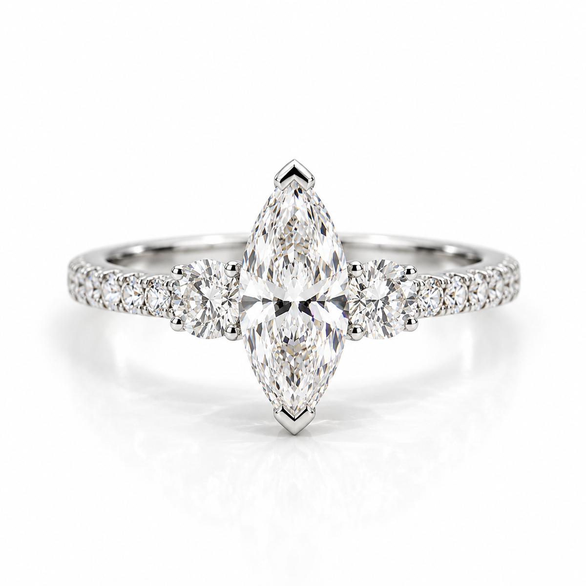 Small polished silver marquise three-stone engagement ring with pavé band