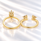 Back view of a marquise cut ring stone showing its pavilion facets, six prongs, and a hidden halo of small stones