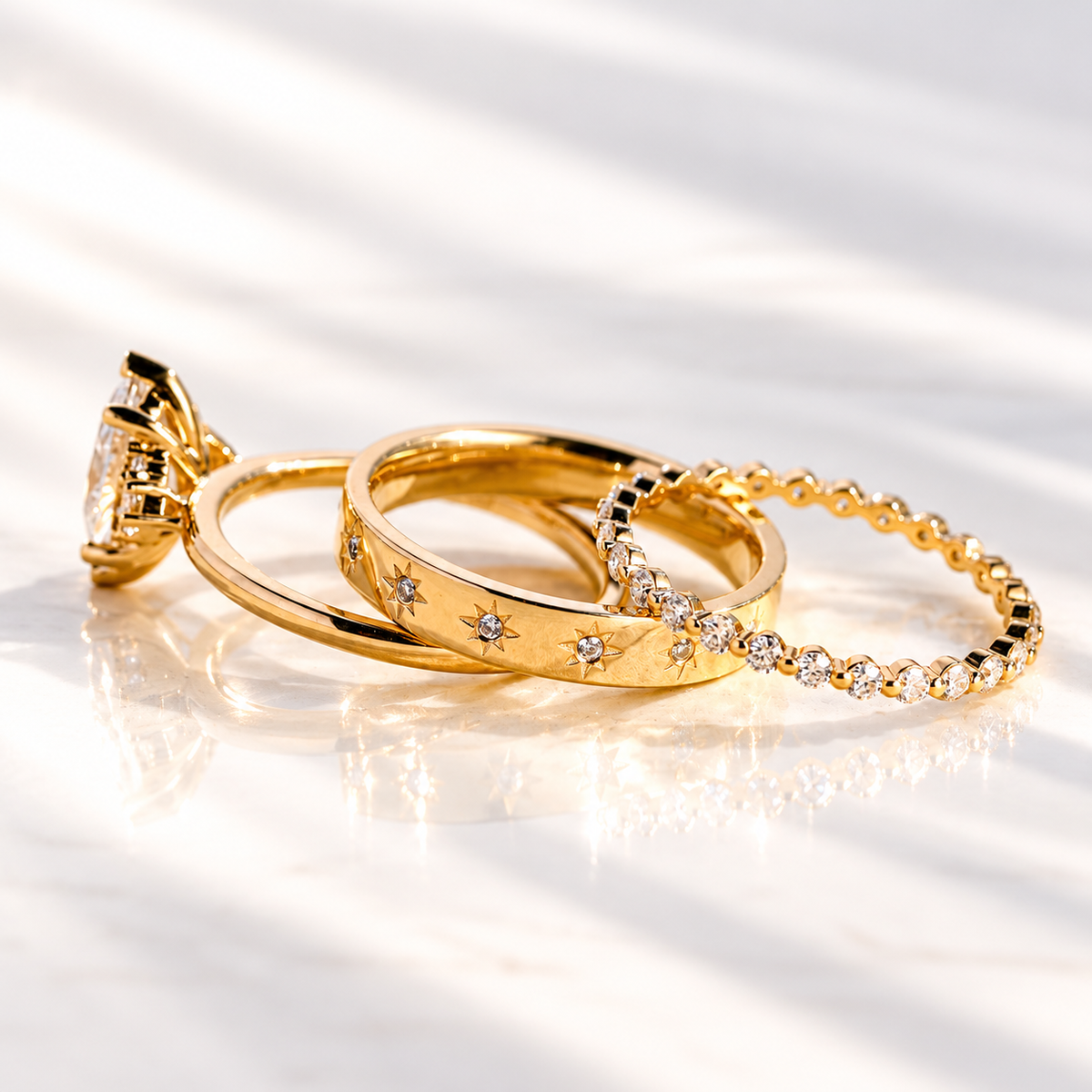 Angled view of a marquise cut colorless ring stone with brilliant facets and prongs, with small round accent stones beside it
