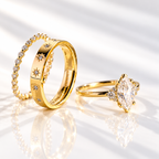 Marquise cut clear ring stone with an elongated pointed shape and bright sparkle, flanked by small round accent stone