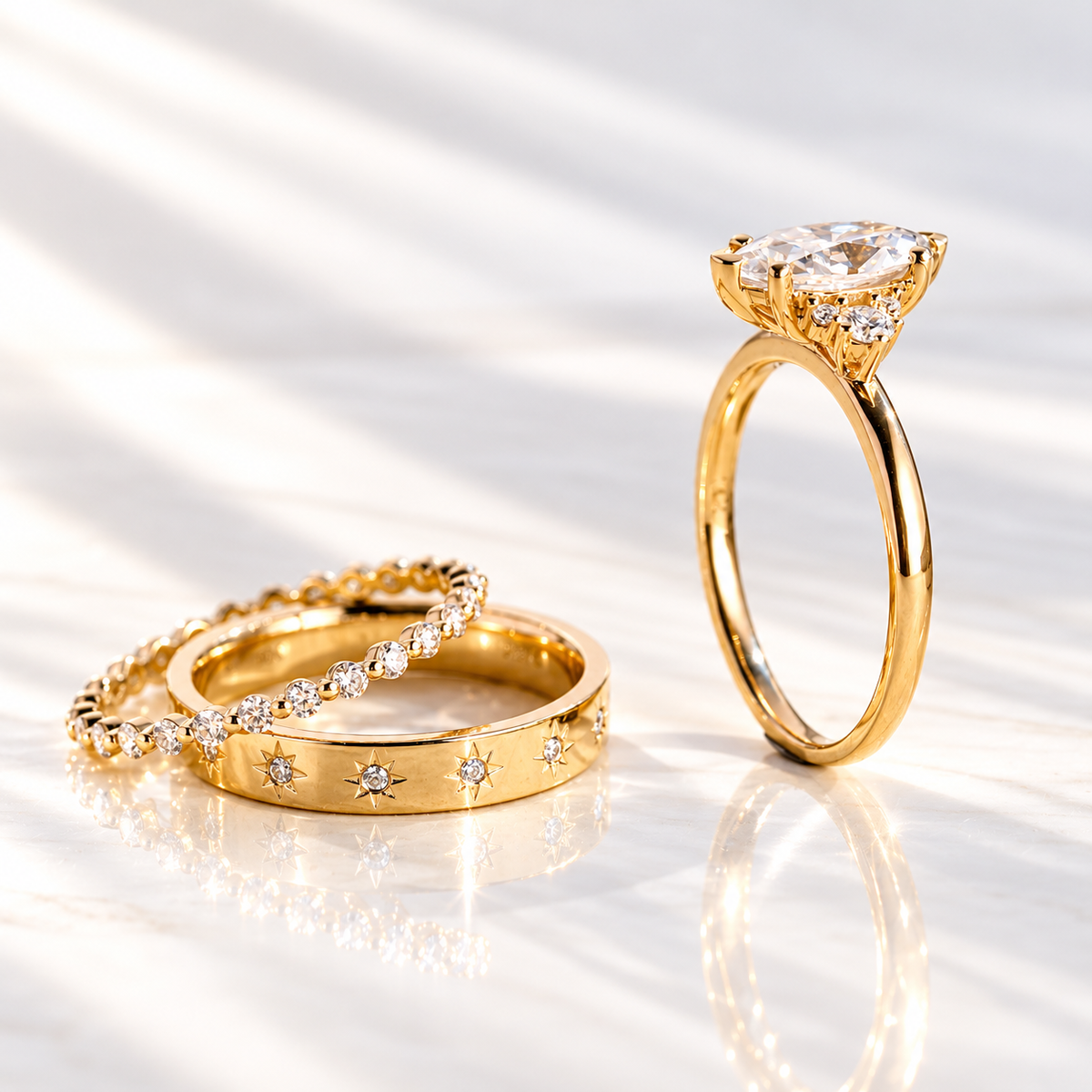 Profile of a marquise cut colorless ring stone showing its stone depth and prong setting, with small accent stones below