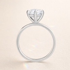 Diamond ring on a light beige background