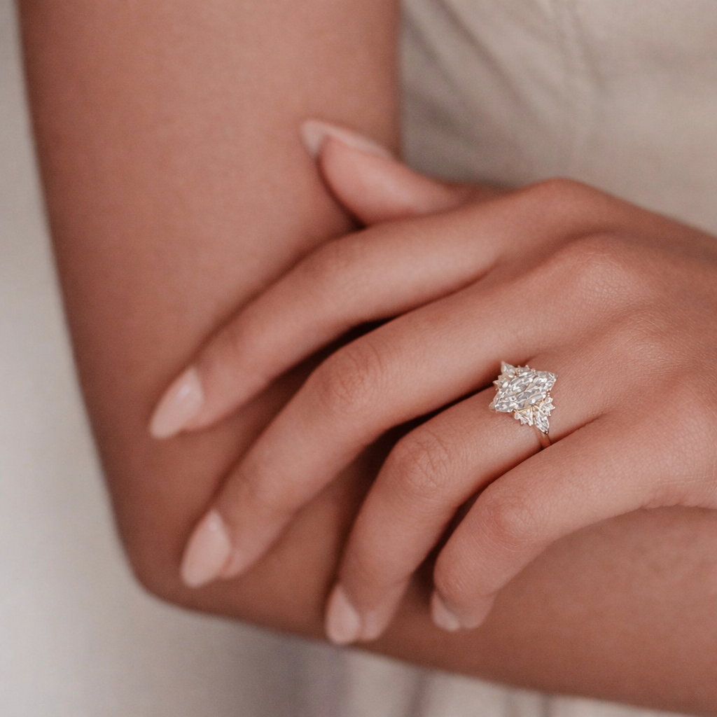 Marquise Moissanite Ring With Marquise And Round Cut Side Stones
