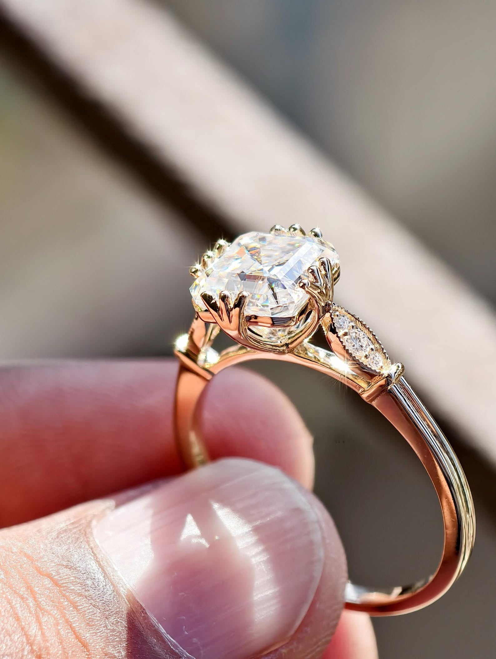 Square Step Cut Diamond Ring With Round Cut Side Stone Cathedral Setting.
