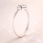 Moissanite Engagement Ring Featuring Three Round Cut Stones And Milgrain Detail
