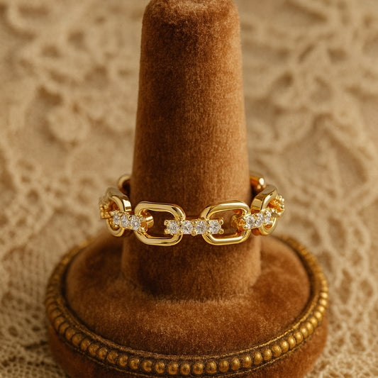 Luxury gold chain link ring with sparkling diamond accents
