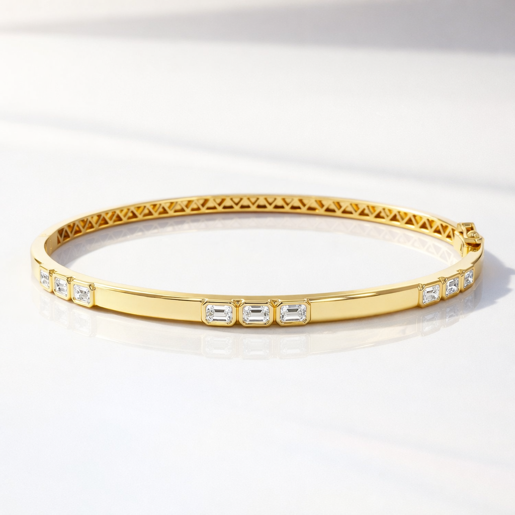 Gold bracelet stack with emerald cut diamond bracelets
