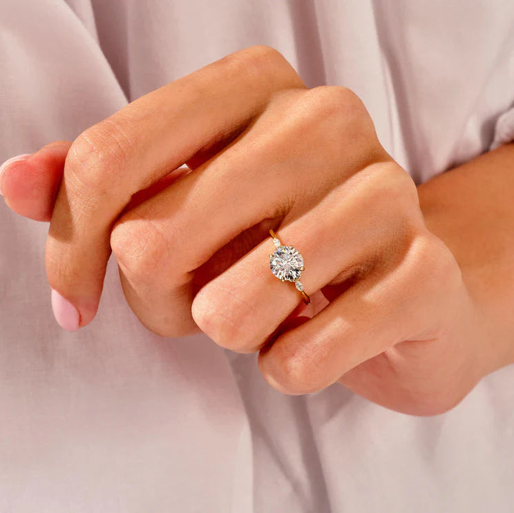 Four claw prong cluster engagement ring design
