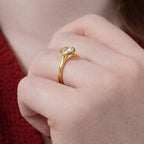 Classic Round Cut Diamond Ring With A Polished And Timeless Band.
