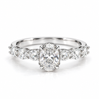 Silver oval-cut engagement ring with sparkling side stones and polished silver band