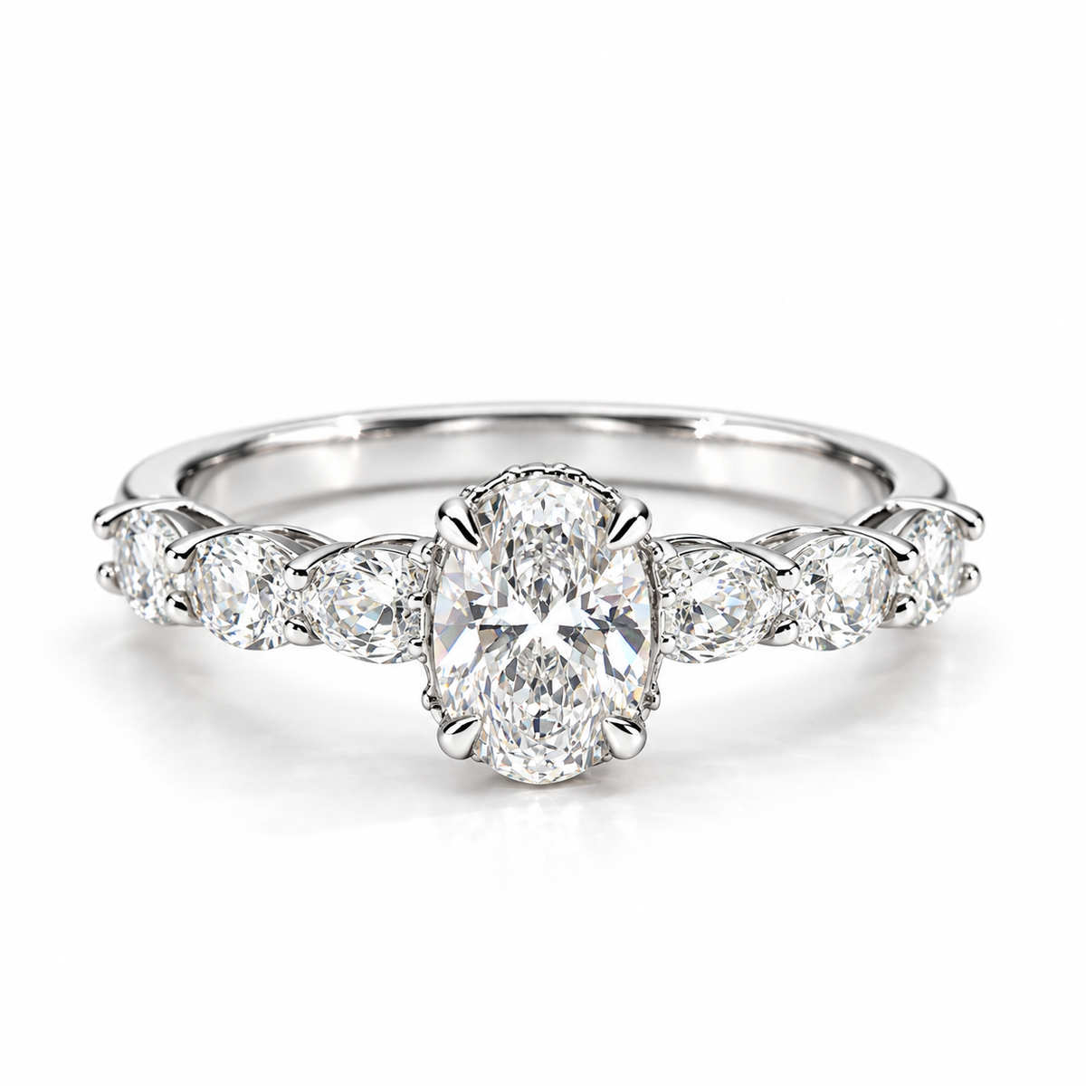 Silver oval-cut engagement ring with sparkling side stones and polished silver band