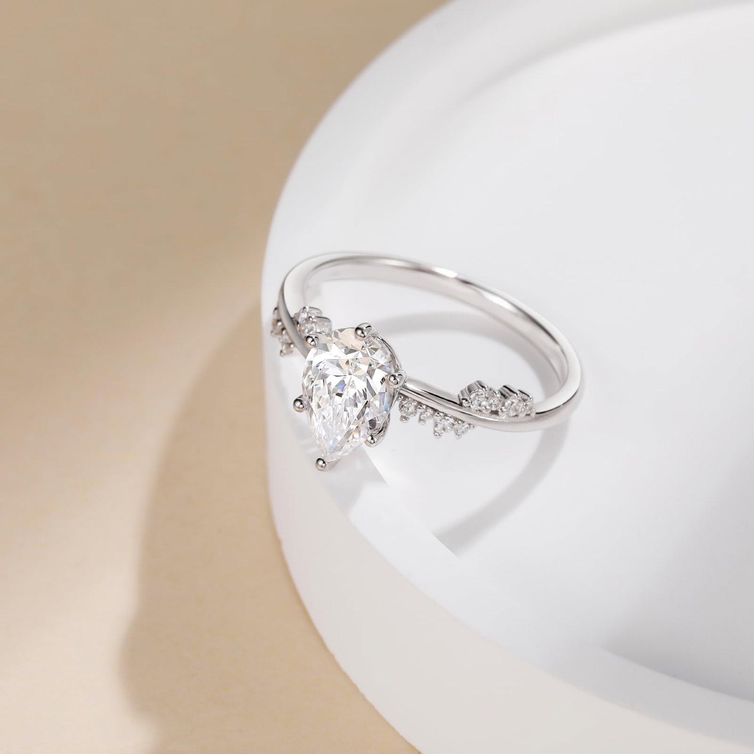 Moissanite Engagement Ring Pear Cut Round Cut Diamond Side Stone Gold Setting.
