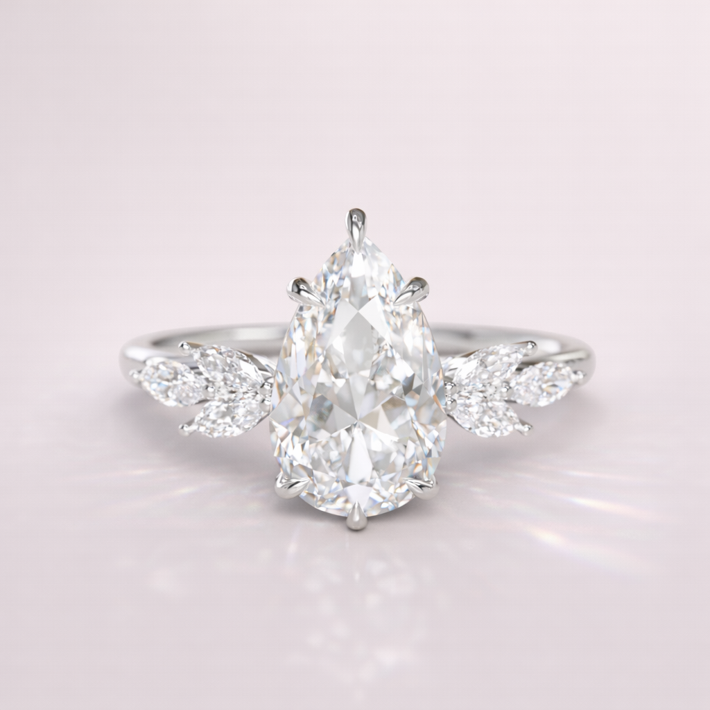 Teardrop Shaped Engagement Ring With Pear Cut Center And Marquise Side Stones
