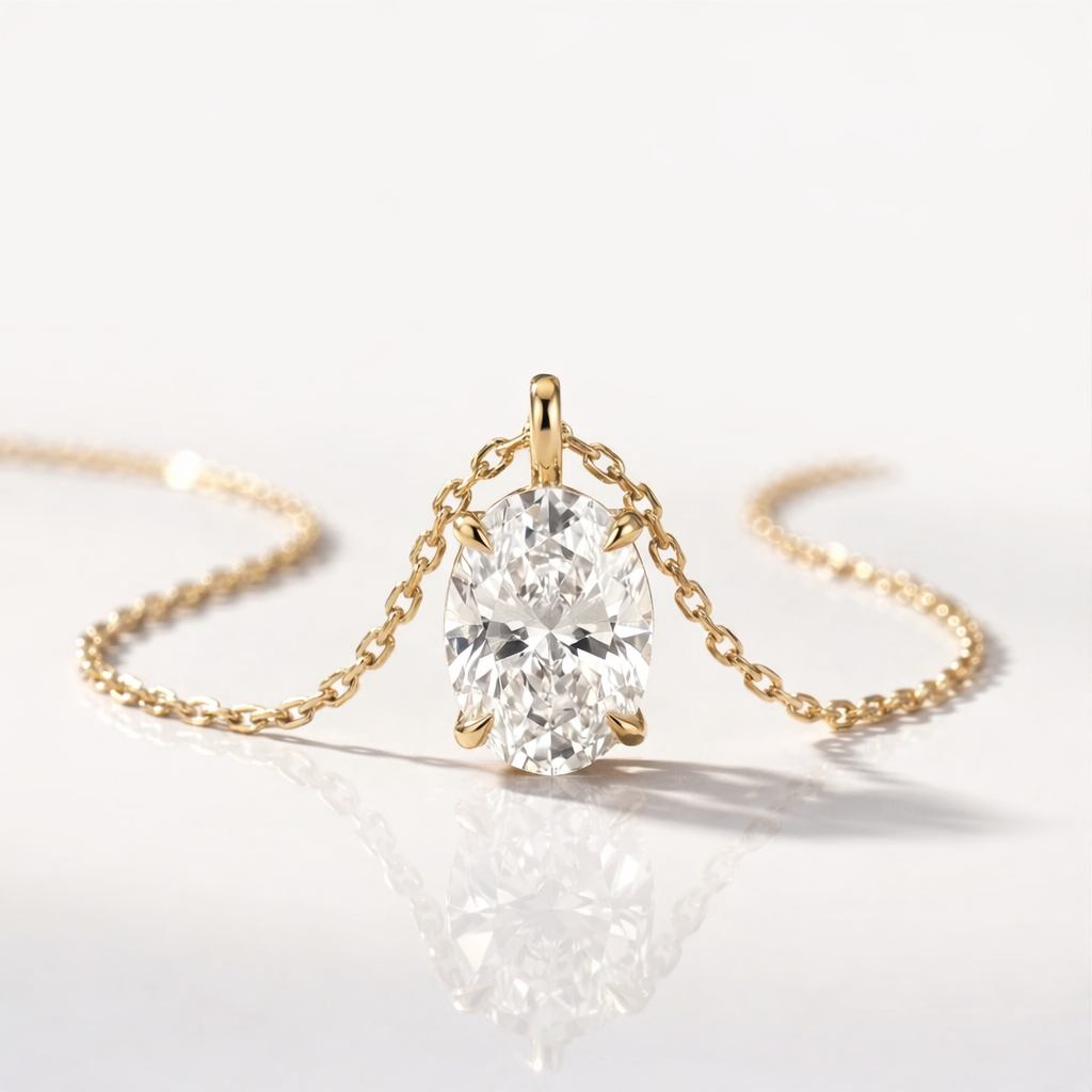 Yellow Gold Pendant Featuring An Oval Moissanite Stone With Prong Setting.
