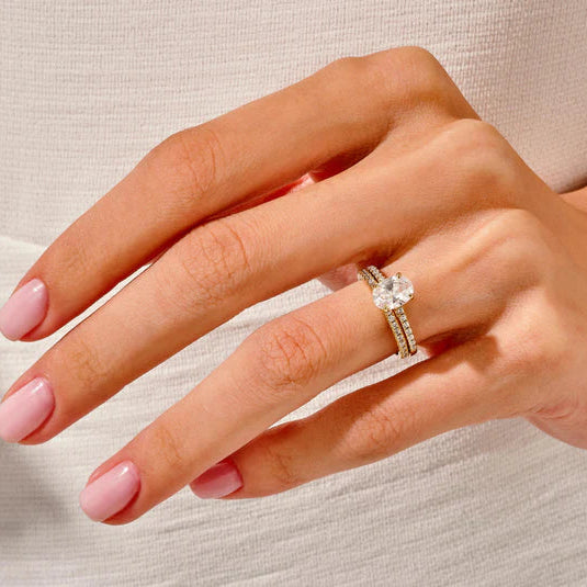 Oval cut diamond ring with half eternity band
