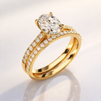 White gold oval diamond ring with matching band
