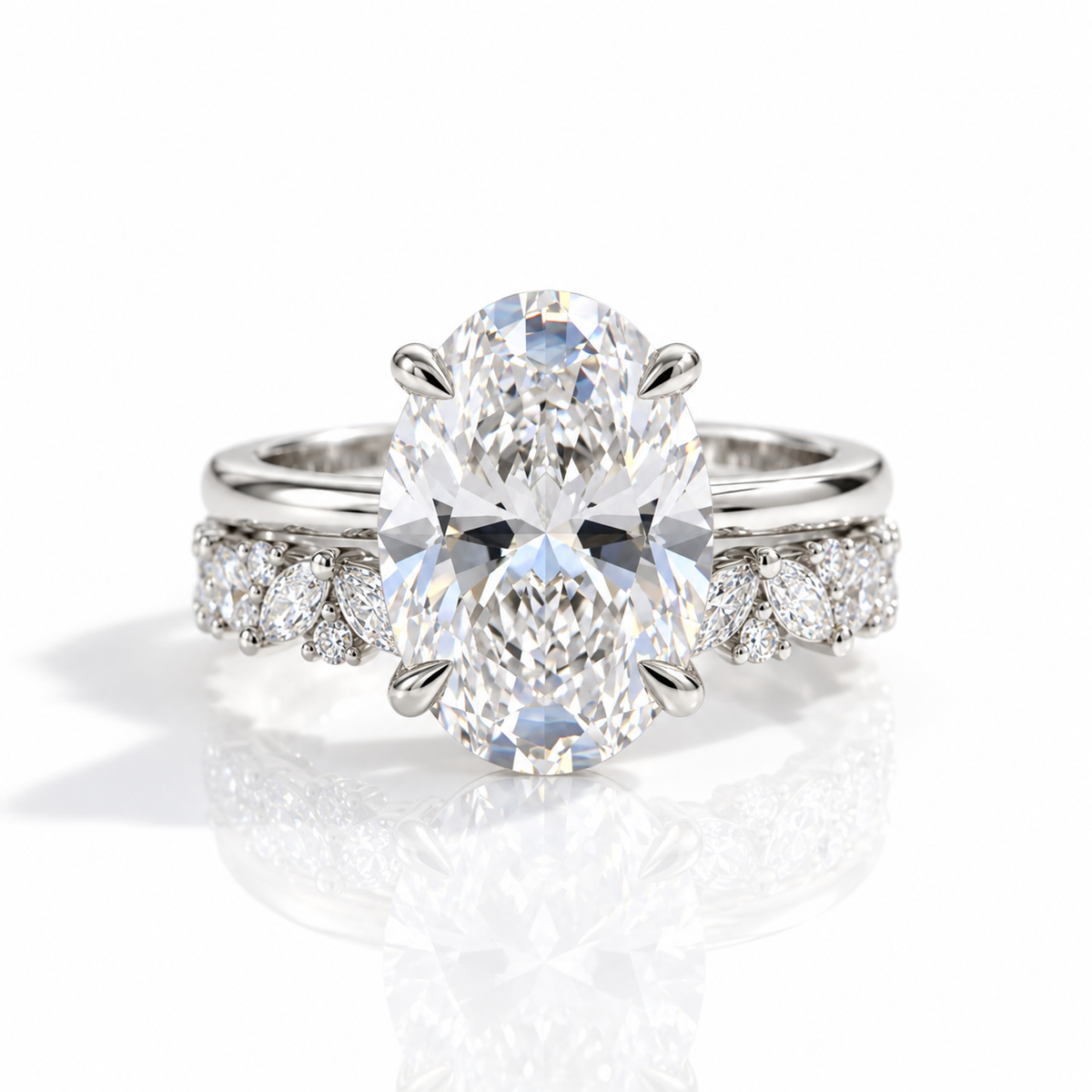 Silver oval-cut engagement ring with diamond floral side accents on a white background.