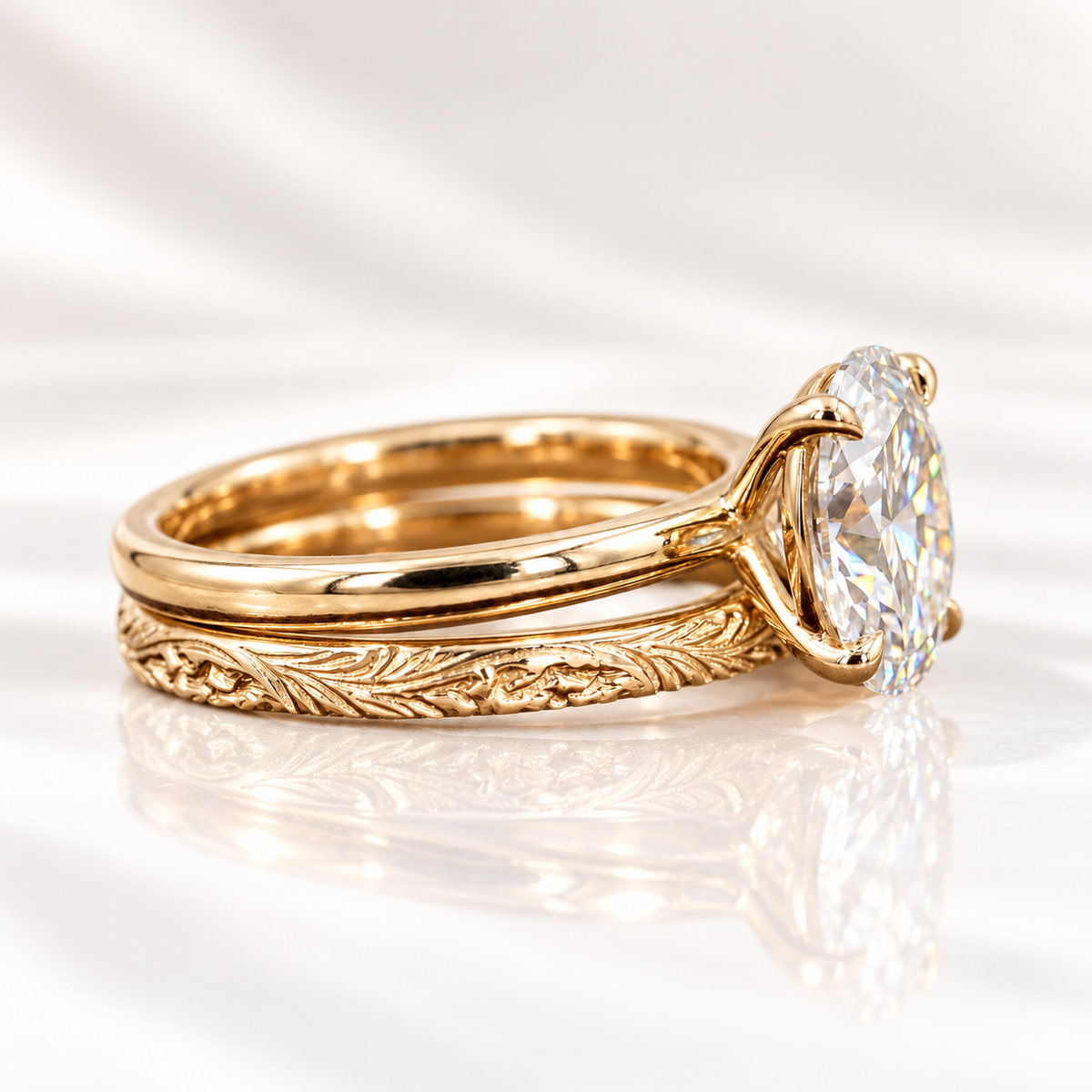 Side angle of an oval cut ring stone showing its depth, brilliant facets, and four-prong setting