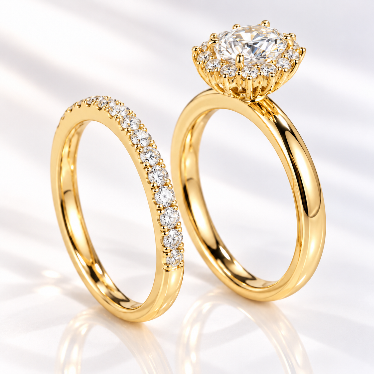 Top angled view of an oval cut colorless ring stone with bright brilliant facets and a halo of small round stones