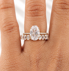 Oval cut colorless ring stone with a clear table, symmetrical oval outline, and bright brilliant facets
