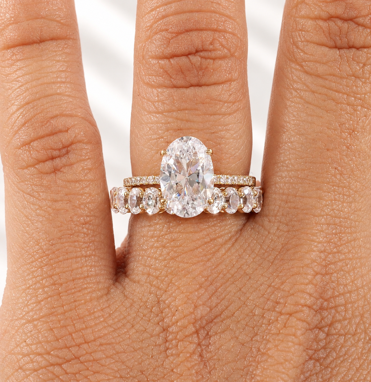 Oval cut colorless ring stone with a clear table, symmetrical oval outline, and bright brilliant facets