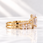 Side view of an oval cut ring stone showing its depth and bright facets, with a hidden halo of tiny stones below
