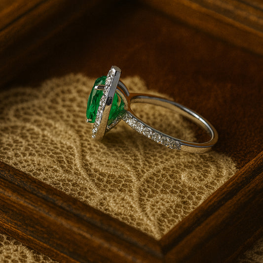 Oval-Shaped Green Emerald Ring with Sparkling Diamond Halo Setting - Luxury Bridal Jewelry