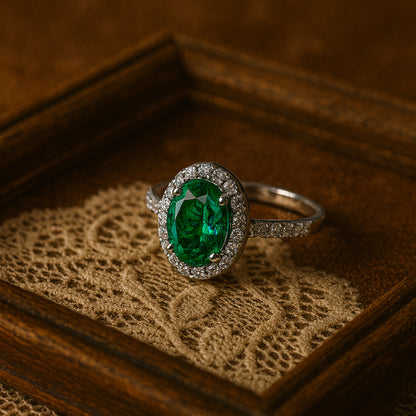 Close-Up of 2 Carat Oval Emerald Surrounded by Brilliant Diamond Halo - Ethical Fine Jewelry