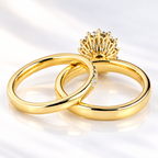 Back view of an oval cut ring stone showing its pavilion facets and many fine prongs holding the surrounding halo stones