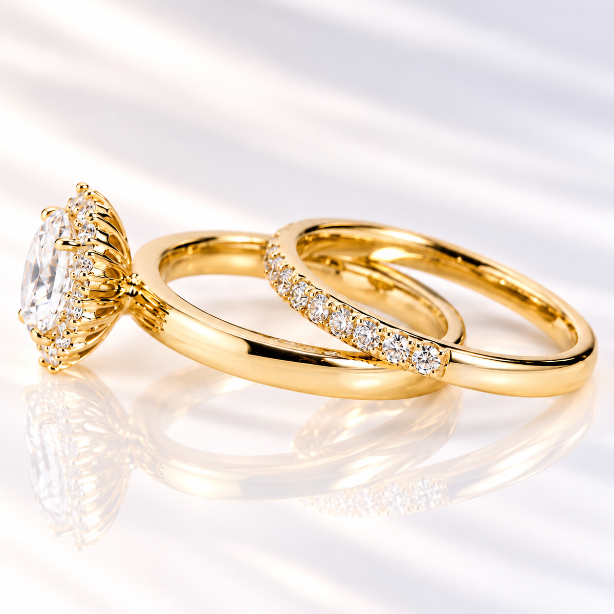 Side angle of an oval cut ring stone showing its depth, brilliant facets, and a halo of small round stones around it