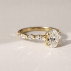 Oval Side Stone Engagement Ring With Moissanite And Diamond Accents
