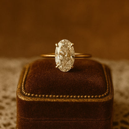 Classic Female Engagement Ring With Oval Moissanite Stone Offering Brilliant Fire And Clarity In Minimalist Gold Setting