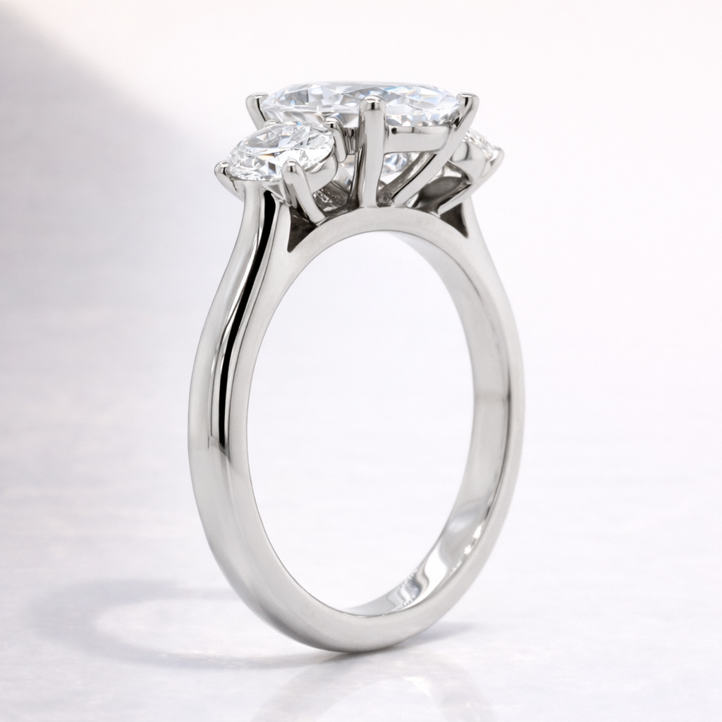 Oval Cut Diamond Engagement Ring Featuring Three Stone Prong Setting
