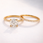 Round cut diamond ring with pave wedding band
