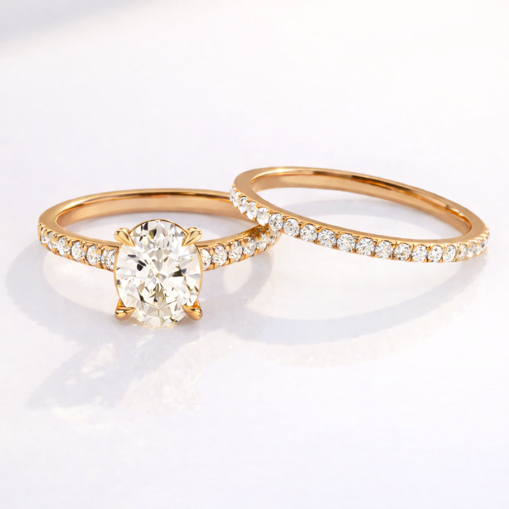 Yellow gold oval engagement ring wedding band set
