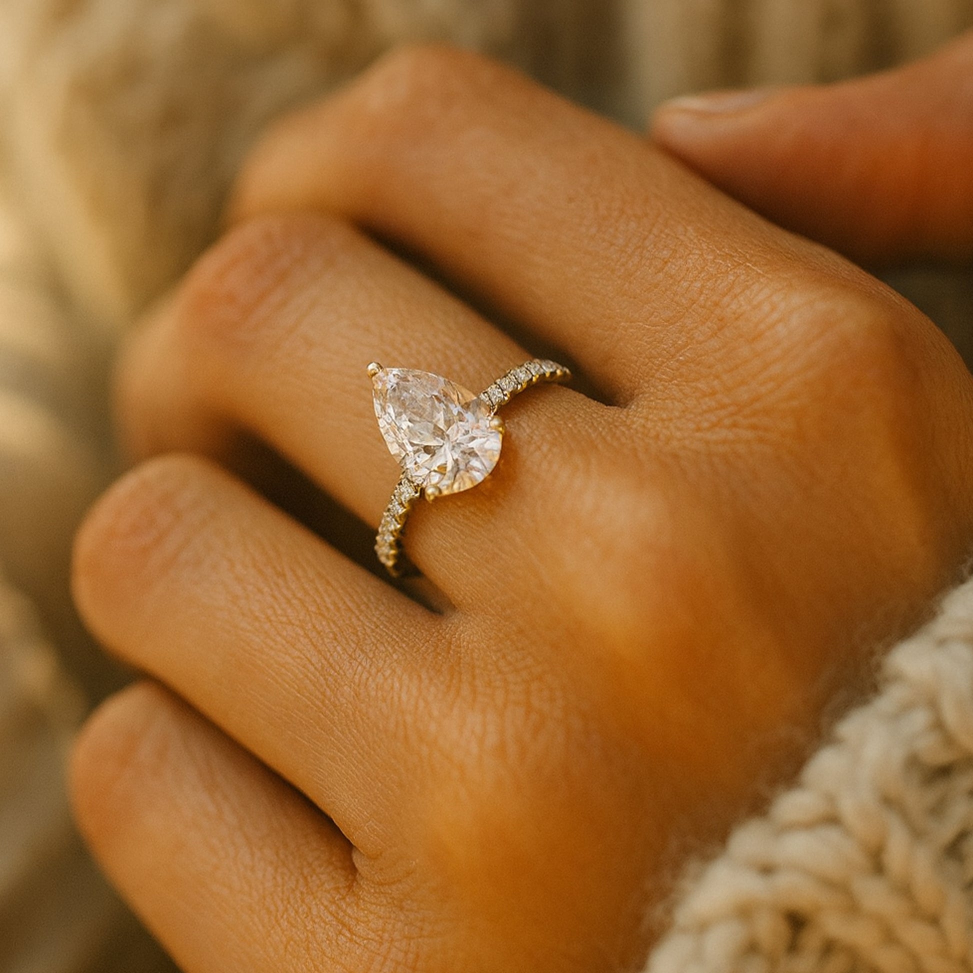 Diiro Pear Diamond Solitaire Ring In Gold Featuring A Brilliant Teardrop-Cut Diamond And Pavé Band For Timeless Elegance.