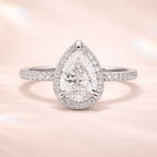 Pear Cut Diamond Ring With Round Cut Halo Setting
