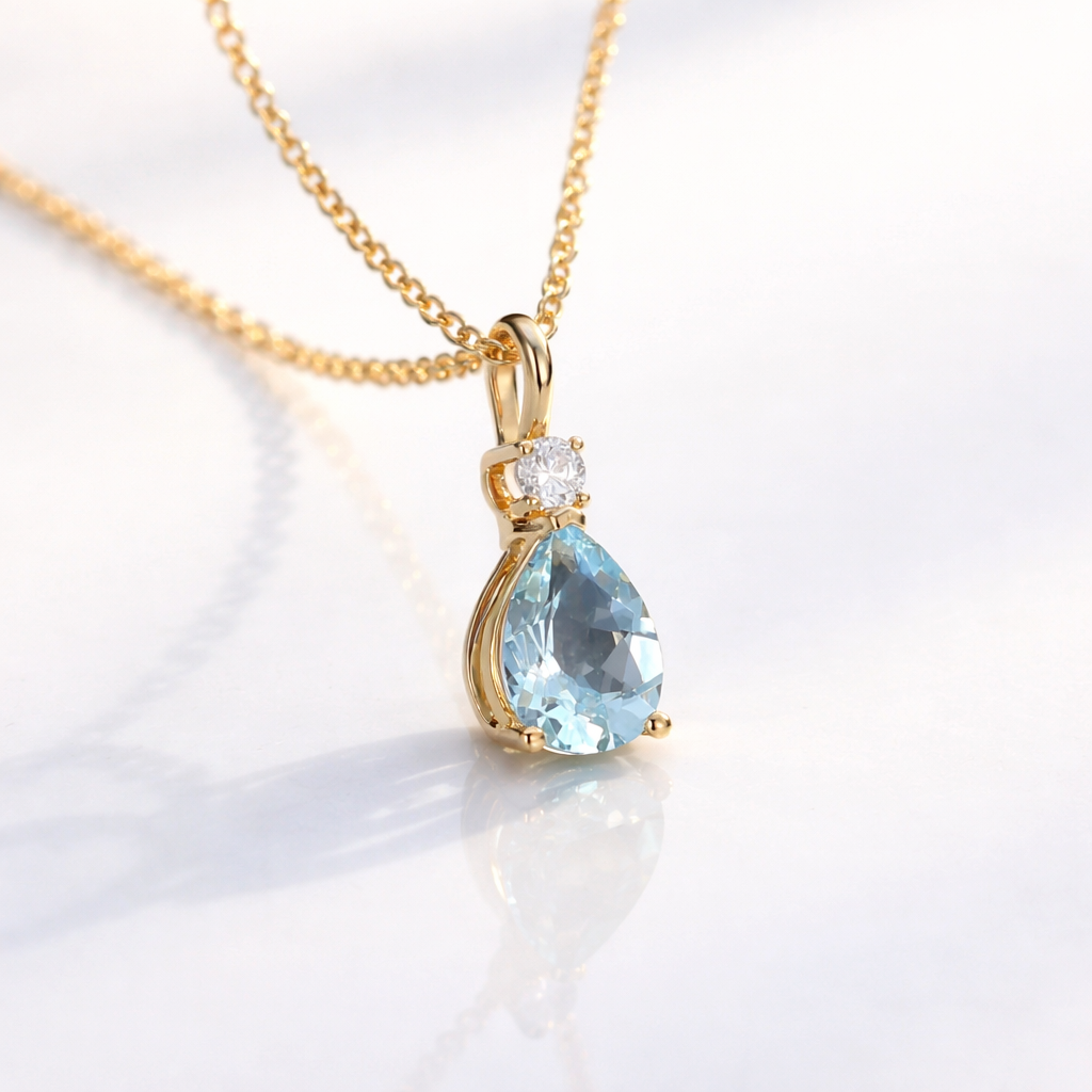 Elegant Yellow Gold Aquamarine Pendant With Round Diamond Accent.
