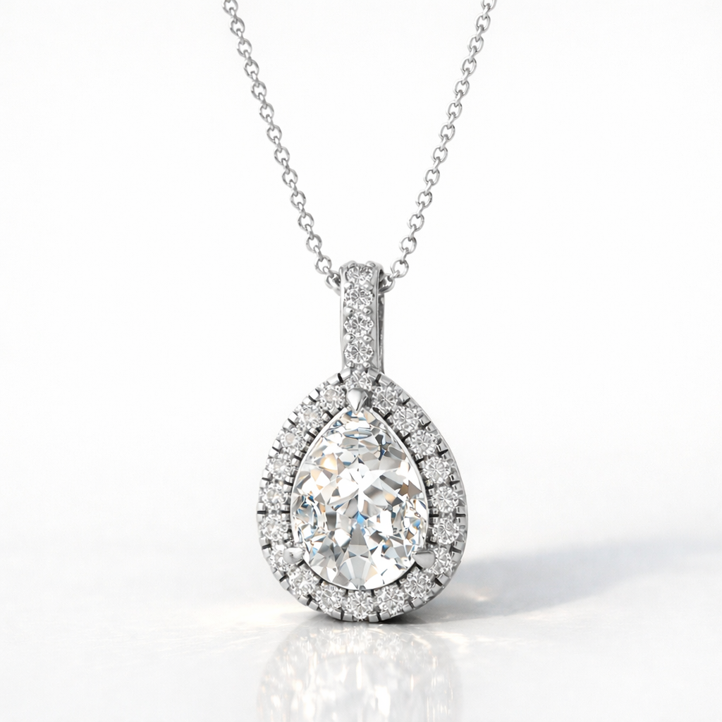 Pear-Shaped Diamond Pendant In Yellow Gold With A Round-Cut Halo Setting.
