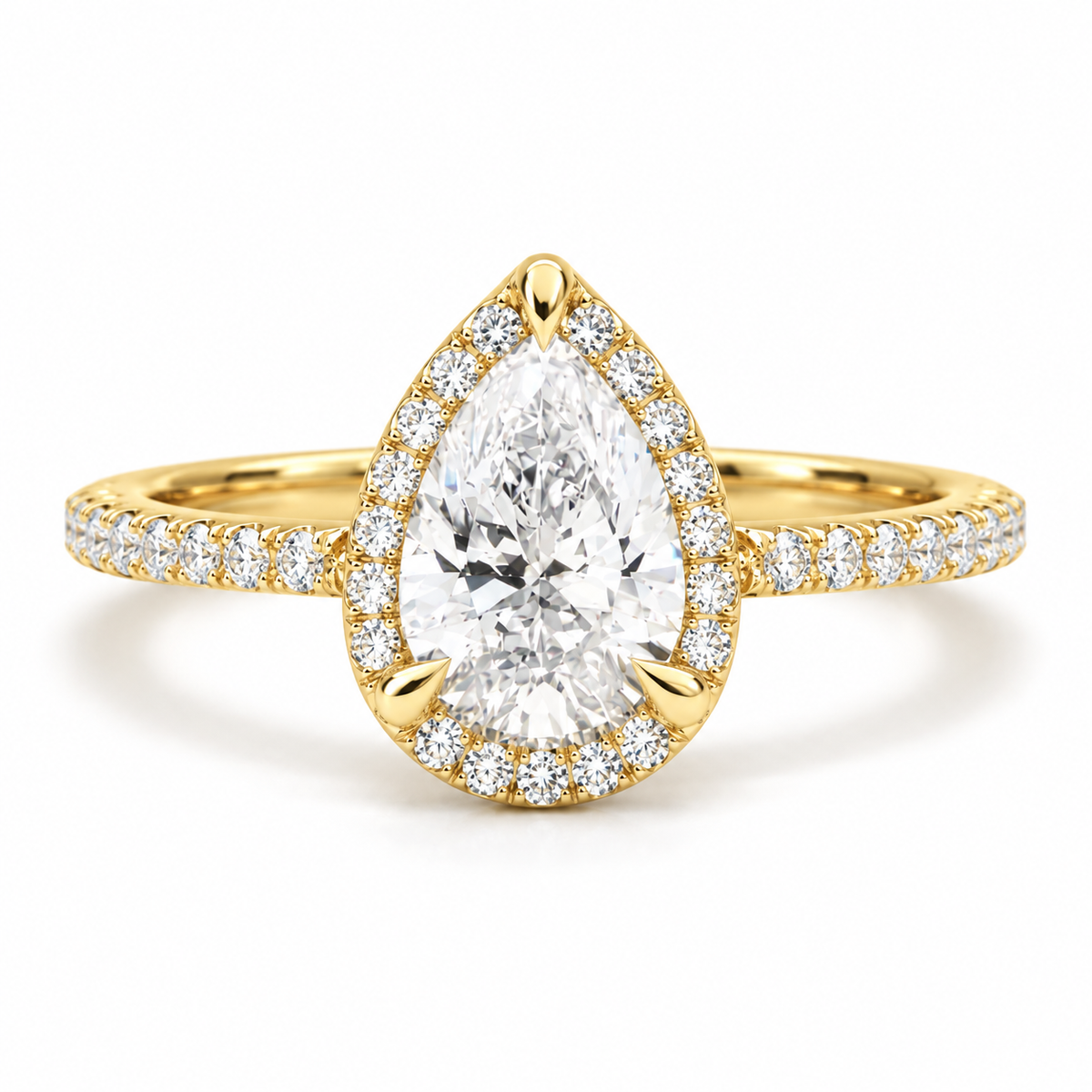 18K yellow gold pear shaped halo engagement ring with a sparkling pear cut center stone and pavé diamond halo on a diamond accented band