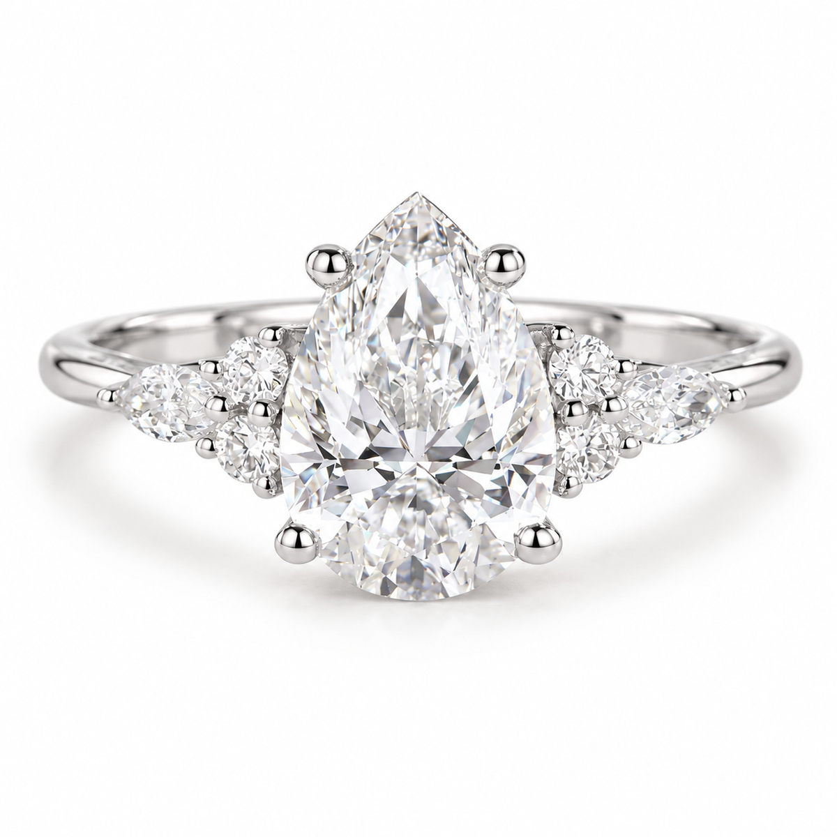 Luxury pear shaped moissanite engagement ring featuring a bright polished silver band, secure prong setting, marquise side stones, and sparkling round diamond accents for a timeless wedding ring style.