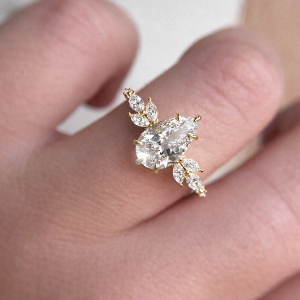 Pear Cut Engagement Ring With Marquise And Round Side Diamonds
