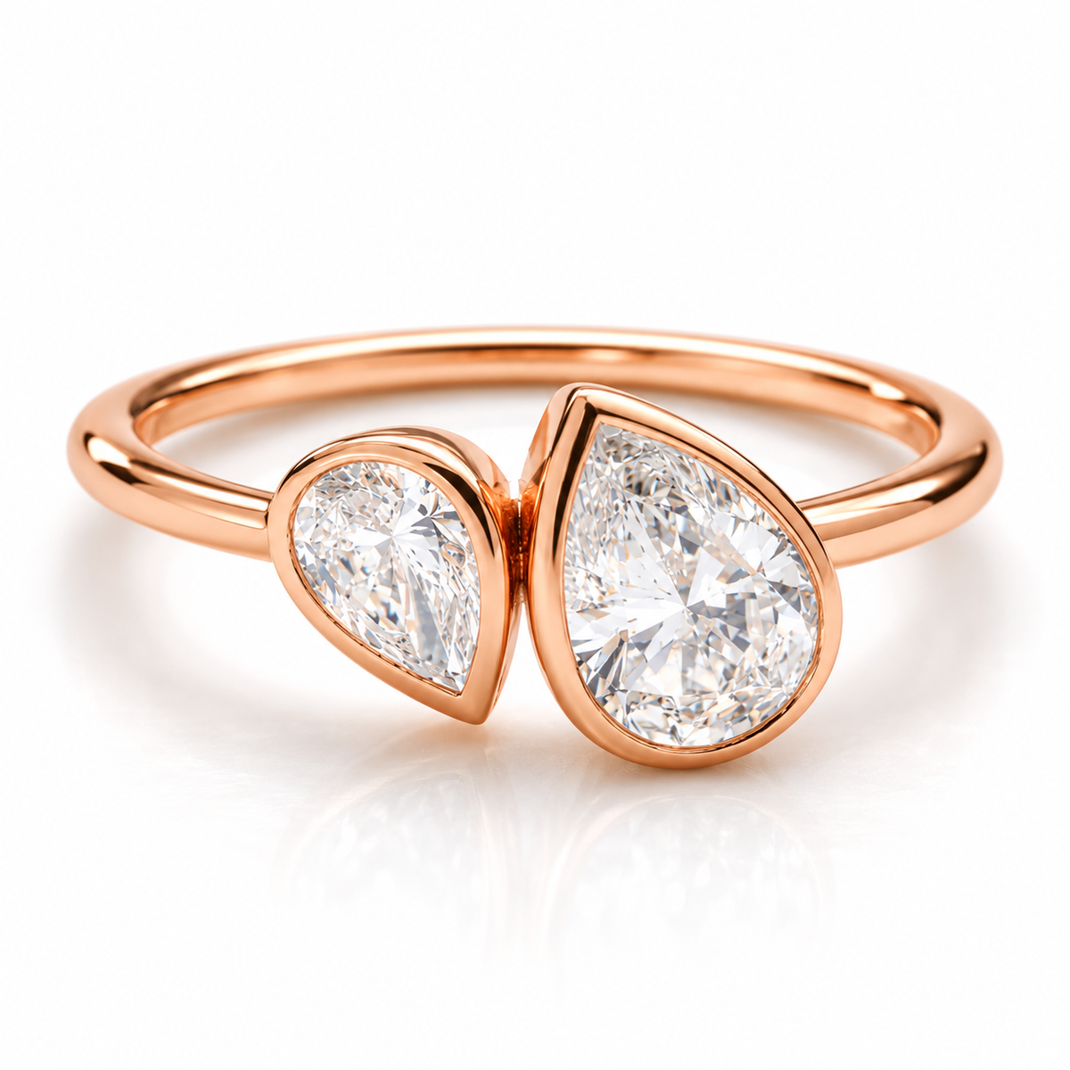 18K rose gold vermeil bypass ring with two pear-shaped sparkling gemstones in bezel settings