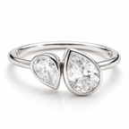 Polished silver bypass ring with two pear-shaped sparkling gemstones in bezel settings