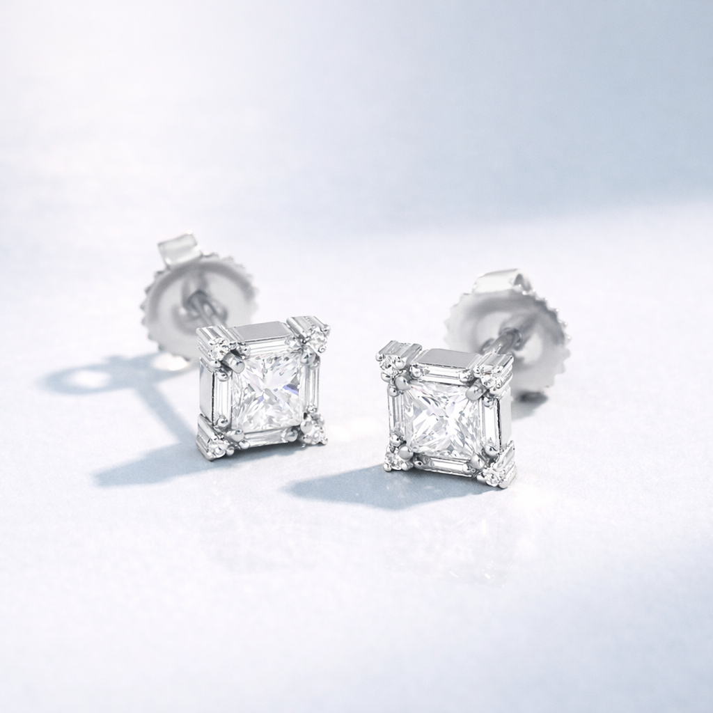 Princess Cut Diamond Stud Earrings Surrounded By Round And Baguette White Diamonds.
