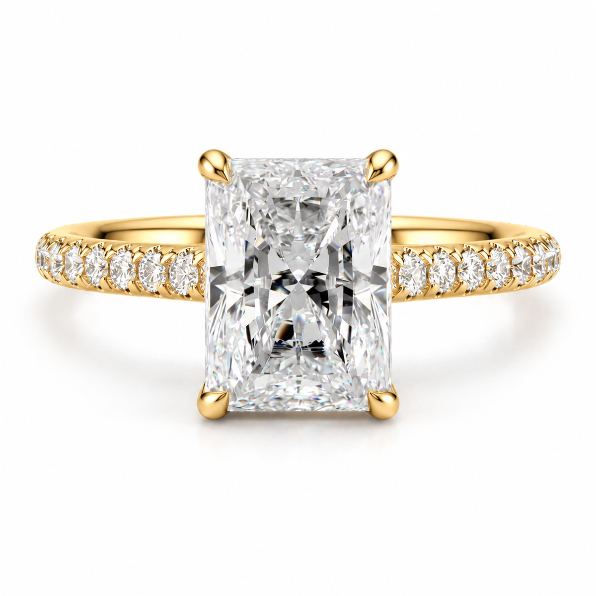 18K yellow gold radiant cut diamond engagement ring featuring a brilliant rectangular center diamond, sparkling pavé side stones, and classic bridal ring design