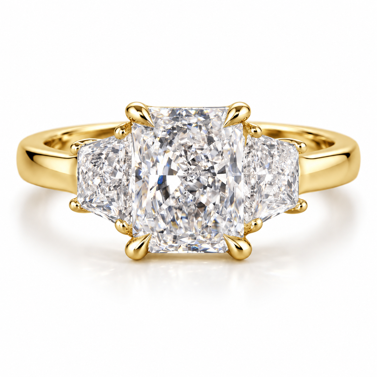 Three stone radiant cut diamond engagement ring featuring a large center diamond with matching side stones, set in a polished gold band with a timeless luxury jewelry design.